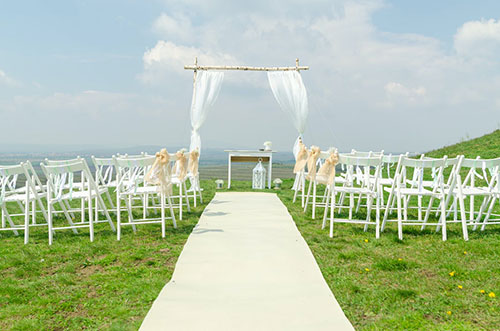 Your wedding arch shouldn’t outshine the landscape around
