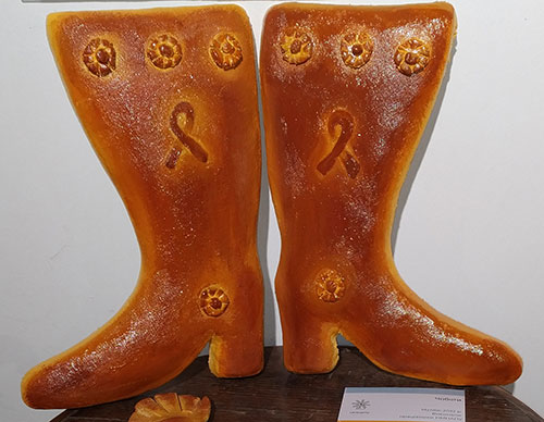 Ukrainian grooms present their new mother-in-law with boot-shaped pastry